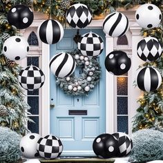 black and white christmas decorations hanging from the front door