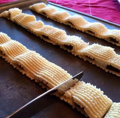 waffles being cut with a knife on a cutting board