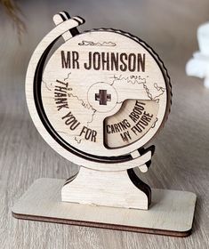 a wooden globe with the words mr johnson on it