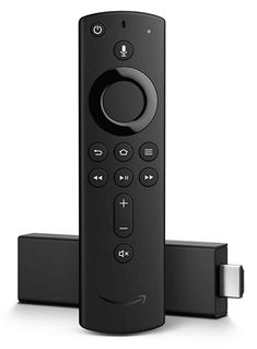 an amazon fire tv remote sitting on top of two other remotes next to each other