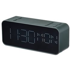 an alarm clock is shown with the time at 11 00 pm on it's display