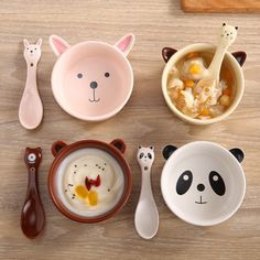 various bowls and spoons with animal faces on them, along with utensils