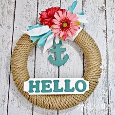 a rope wreath with an anchor and flower on it that says hello written across the front