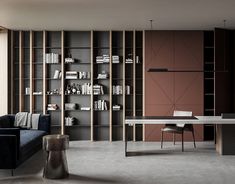 a living room filled with furniture and bookshelves next to a large glass window