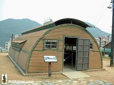 a small building with a sign in front of it