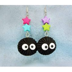 pair of black earrings with colorful stars and eyes