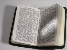 an open book sitting on top of a table