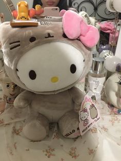 a hello kitty stuffed animal sitting on top of a table