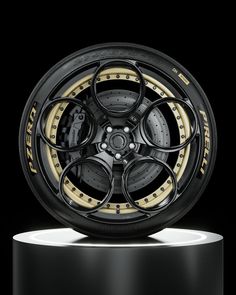 a wheel with gold rims on a black background