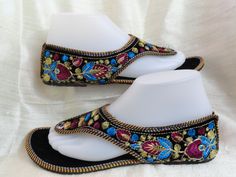 Casual, colourful shoes and sandals in leather from India: Fashion footwear for the contemporary city dweller, from five centuries back. Mumtaz, the lady for whom the Taj Mahal was built probably lived in shoes and sandals much like these. Originally meant for the Maharajahs and the Maharanis [Kings and Queens and such royalty], these handcrafted fashion footwear for men and women mainly come from the villages of Punjab and Rajasthan. This period fashion piece was introduced to India during the Multicolor Embroidered Open Toe Sandals, Embroidered Multicolor Open Toe Sandals, Bohemian Multicolor Embroidered Sandals, Traditional Blue Closed Toe Sandals, Traditional Handmade Closed Toe Huarache Sandals, Traditional Closed Toe Huarache Sandals For Festivals, Festival Sandals With Cutdana And Round Toe, Traditional Sandals With Single Toe Strap For Festive Occasions, Traditional Handmade Barefoot Sandals With Round Toe