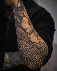 a man with a tattoo on his arm