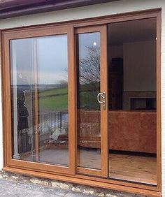 the sliding glass doors are open to let in some light and privacy outside this house