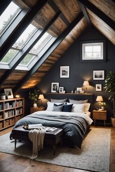 an attic bedroom with black walls and wooden floors