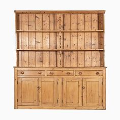 an old wooden cabinet with drawers and cupboards on the front, against a white background