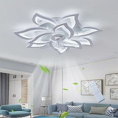 the living room is decorated in white and blue tones with green accents on the ceiling