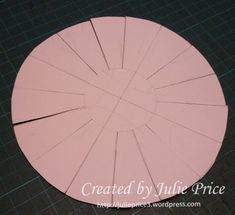 a circular cut out of paper sitting on top of a table