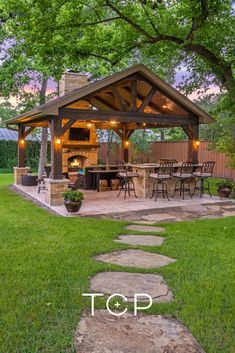 an image of a gazebo in the yard with lights on it's roof