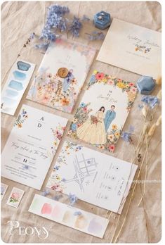 the wedding stationery is laid out on the table