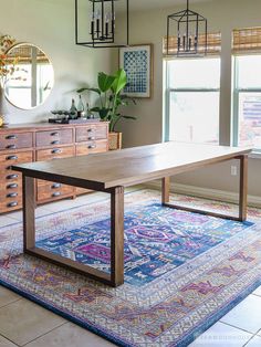 a living room filled with furniture and lots of windows