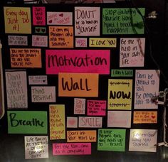 a bulletin board with lots of notes attached to it