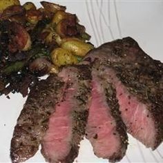 steak, potatoes and broccoli on a white plate