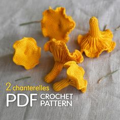 three crocheted yellow flowers sitting on top of a gray tablecloth with text overlay that reads, 2 chanterelles crochet pattern