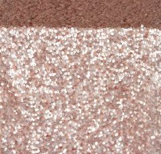 a brown and white background with some silver glitters on it's side,