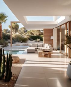 a living room filled with furniture next to a pool