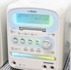 a radio sitting on top of a table next to other electronics