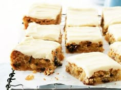 several pieces of cake sitting on top of a cooling rack