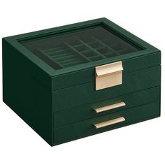 a green box with gold handles and drawers on the bottom is shown in front of a white background