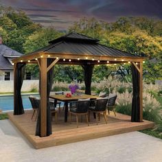 an outdoor gazebo with lights on it