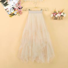 This is perfect for those who are looking for a clothing for a good price. It is fashionable, stylish, and it will look great on anyone who wears it. Do you wanahavit? Summer Tulle Maxi Flared Skirt, Summer Flared Tulle Maxi Skirt, Beige Party Skirt For Spring, Beige Ruffled Skirt For Parties, Spring Party Beige Skirt, Tulle Maxi Skirt For Party, Summer Party Tiered Maxi Skirt, Beige Party Skirt With Ruffles, Beige Tiered Skirt For Party