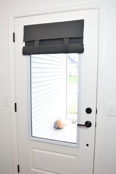 an open door with a black blind on it