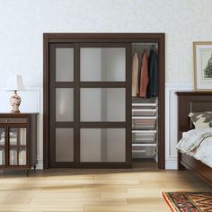 a bedroom with a bed, dresser and closet