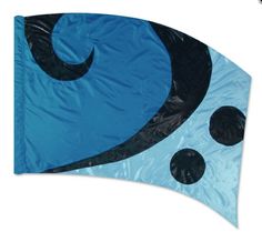 a blue kite with black polka dots on it