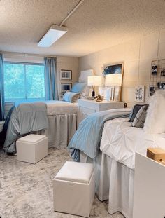 a bedroom with three beds and two nightstands