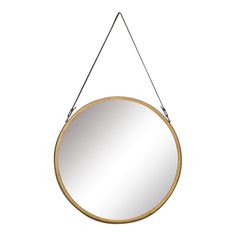 a round mirror hanging from a metal hook on a white wall with a black cord