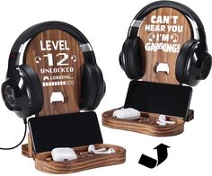 two wooden headphones with ear phones attached to them, one is plugged in and the other is charging