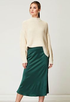 ANGELEYE Emerald Satin Midi Skirt | Little Black Dress Emerald Skirt Outfit, Emerald Clothes, Satin Dress With Sweater, Green Satin Skirt Outfit, Satin Skirt Outfit Classy, Green Satin Midi Skirt, Satin Midi Skirt Outfit, Green Satin Skirt