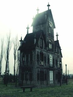 an old building with a clock on the front