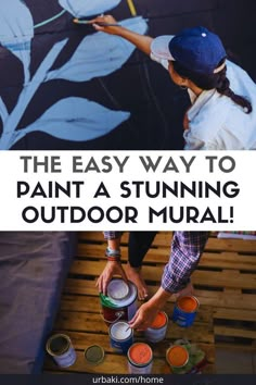 the easy way to paint a stunning outdoor mural is by using buckets and brush