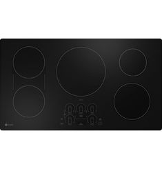 a black stove top with four burners