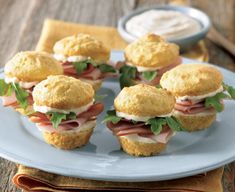 small sandwiches with meat and cheese on a plate