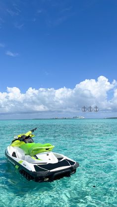 a green and white jet ski in the ocean