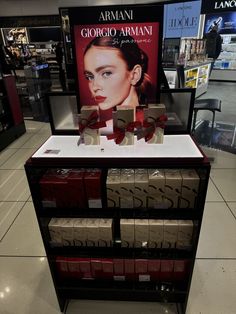 a display in a store filled with lots of boxes and bows on top of it