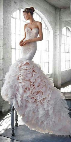 a woman in a wedding dress sitting on a chair