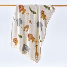 Beautifully detailed knit blanket is roaring with lions, crocodiles, elephants, and giraffes. Handmade-style elements add a special touch--fabric overlay manes, little feet on the crocodiles, and yarn-tipped lion tails. Especially sweet for kids to cuddle under on movie night. 100% cotton. Machine wash. Imported. 32'' x 40''. Baby Blanket Throw, Crocodile Baby Blanket, Animal Shaped Baby Blankets, Kids Pillows And Blankets, Knitted Jungle Baby Blanket, Embroidered Baby Blankets Dafari, Baby Blanket Safari, Drink Candles, Knitted Blanket