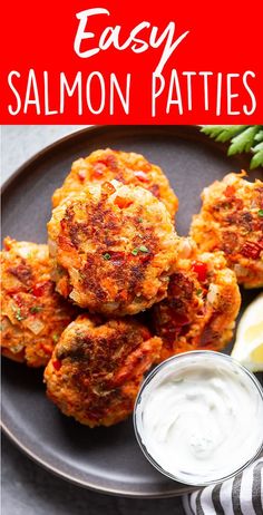 salmon patties on a plate with dipping sauce