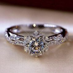 an engagement ring is shown with diamonds on it